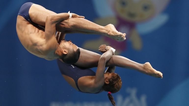 Кубинский синхронный дуэт Тути ГАРСИЯ НАВАРРО и Хеинклер АГИРРЕ МАНСО. Фото REUTERS Кубинский синхронный дуэт Тути ГАРСИЯ НАВАРРО и Хеинклер АГИРРЕ МАНСО. Фото REUTERS