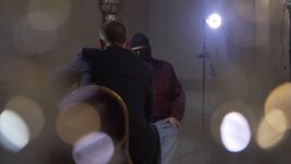 Григорий РОДЧЕНКОВ (лицом к камере) теперь дает интервью в маске.