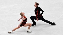 Вчера. Милан. Евгения ТАРАСОВА и Владимир МОРОЗОВ во время проката короткой программы.