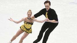 Вчера. Милан. Евгения ТАРАСОВА и Владимир МОРОЗОВ во время проката произвольной программы.