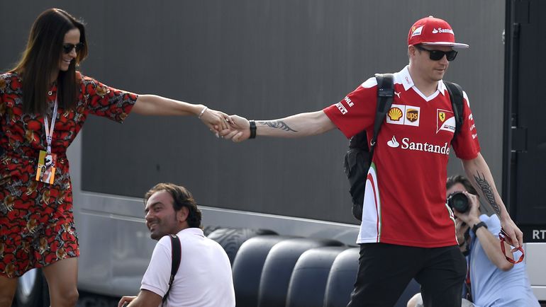 Кими РАЙККОНЕН и его жена Минтту ВИРТАНЕН. Фото AFP Кими РАЙККОНЕН и его жена Минтту ВИРТАНЕН. Фото AFP