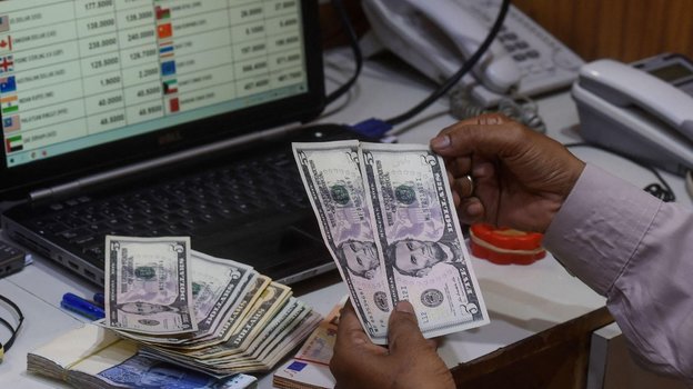 Доллары США. Фото AFP Доллары США. Фото AFP