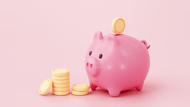 Свинья-копилка на розовом фоне