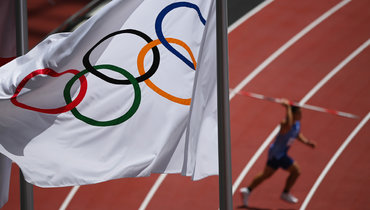 Олимпийский флаг на Играх в Токио.