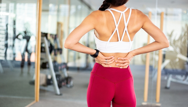 Почему болит поясница во время тренировки и что с этим делать.
