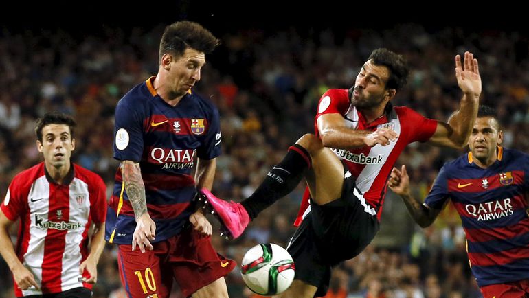 Лионель МЕССИ (слева) против Микеля БАЛЕНСИАГА. Фото REUTERS