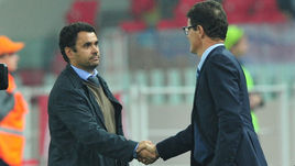 12 октября 2014 года. Москва. Россия - Молдавия - 1:1. Рукопожатие Александра КУРТИЯНА и Фабио КАПЕЛЛО. К матчу в Кишеневе команды готовят другие тренеры, причем по совместительству.