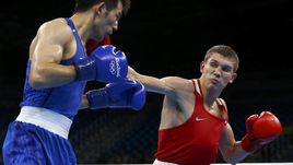 Вчера. Рио-де-Жанейро. Евгений ТИЩЕНКО (справа) атакует Василия ЛЕВИТА.