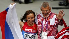 11 августа 2012 года. Лондон. Владимир КАЗАРИН и олимпийская чемпионка в беге на 800 м Мария САВИНОВА.