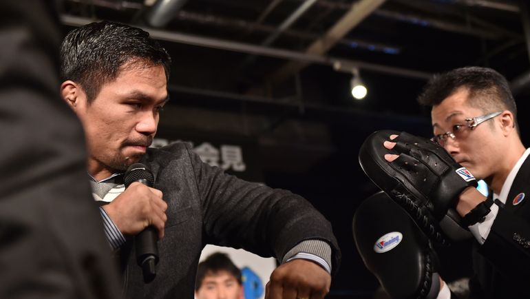 Мэнни ПАКИАО (слева). Фото AFP Мэнни ПАКИАО (слева). Фото AFP